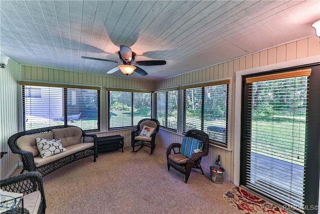 sunroom featuring ceiling fan