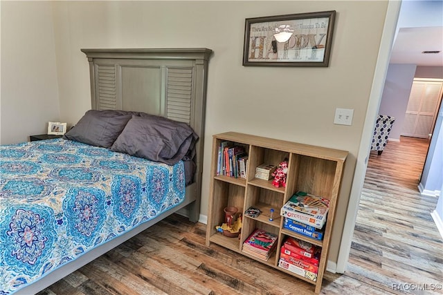 bedroom featuring hardwood / wood-style flooring