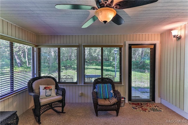 sunroom / solarium featuring ceiling fan