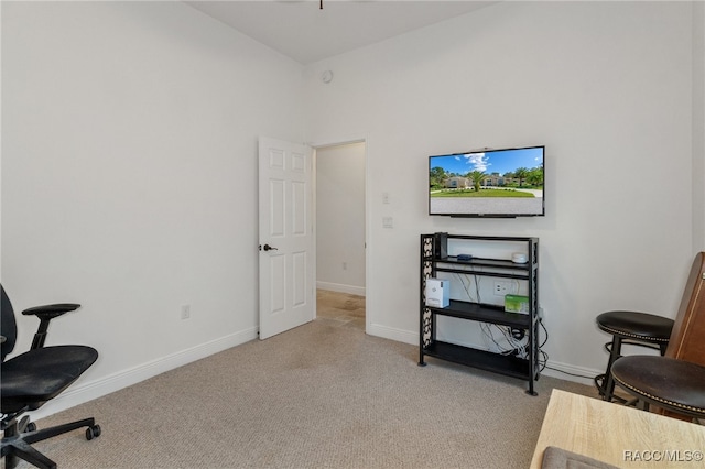 home office with light carpet and baseboards