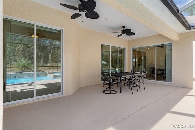 view of patio / terrace with a ceiling fan and outdoor dining area