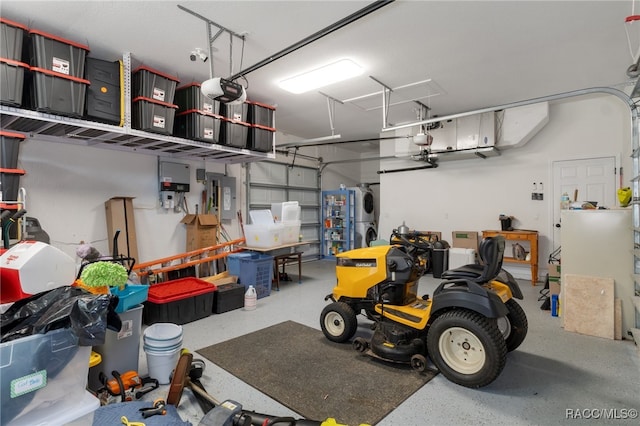 garage featuring electric panel and a garage door opener