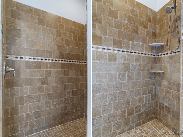 full bathroom with a tile shower