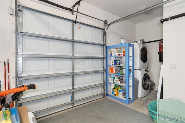 garage with stacked washer / drying machine