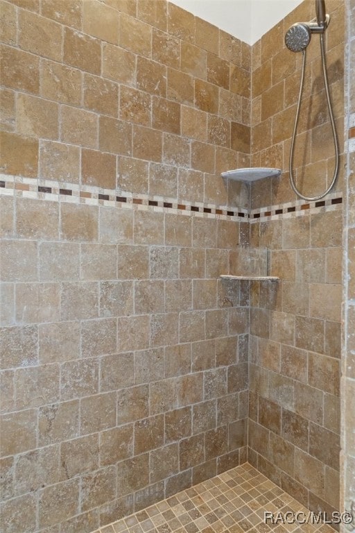 full bathroom with tiled shower