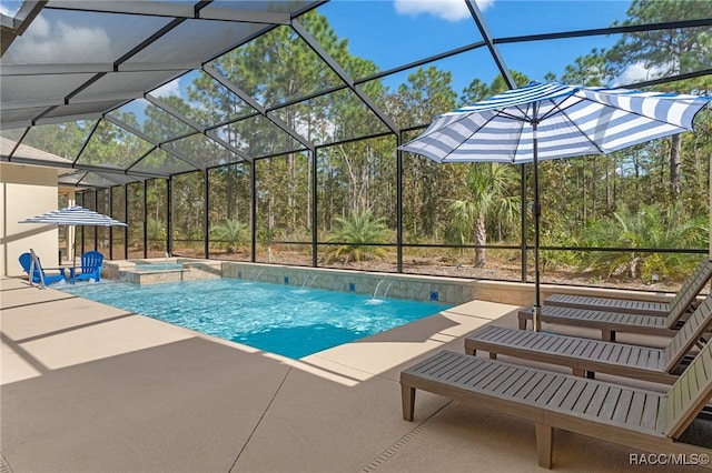 view of swimming pool with a pool with connected hot tub, a lanai, and a patio