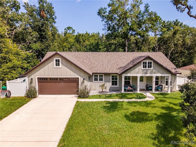 view of front facade with a garage and a front lawn