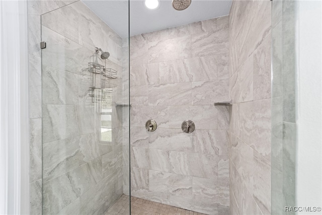 bathroom with tiled shower