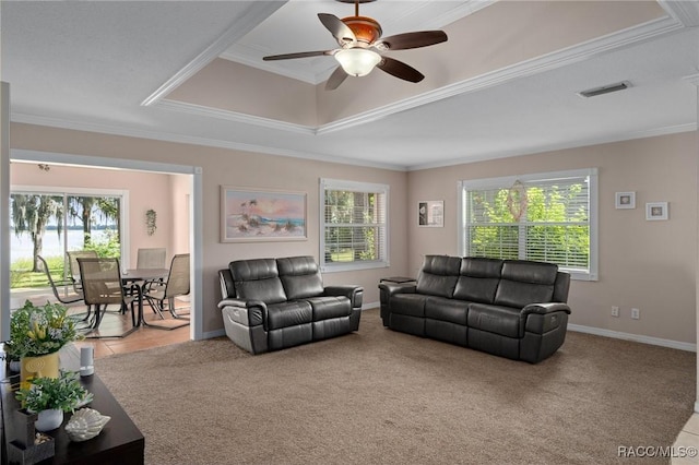 4015 E Parsons Point Rd, Hernando, FL 34442 - carpeted living area with healthy amount of natural light, crown molding, and a ceiling fan