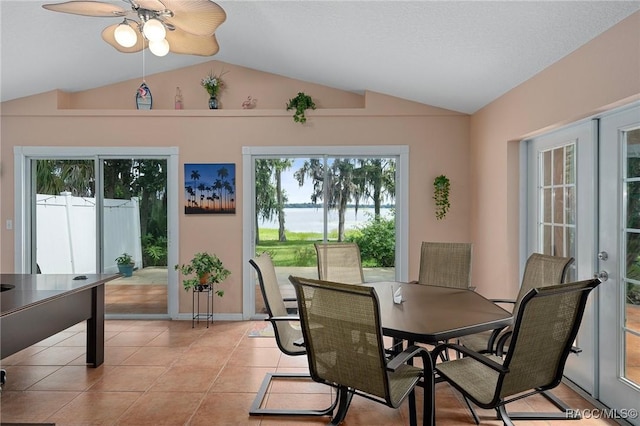 4015 E Parsons Point Rd, Hernando, FL 34442 - dining space with lofted ceiling, plenty of natural light, a water view, a ceiling fan, and light tile patterned floors