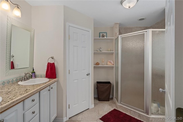 4015 E Parsons Point Rd, Hernando, FL 34442 - bathroom with double vanity, a stall shower, and tile patterned floors