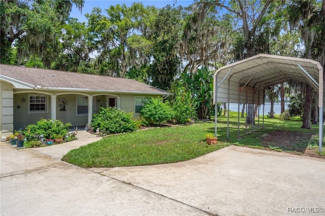 4015 E Parsons Point Rd, Hernando, FL 34442 - view of green lawn featuring a carport and driveway