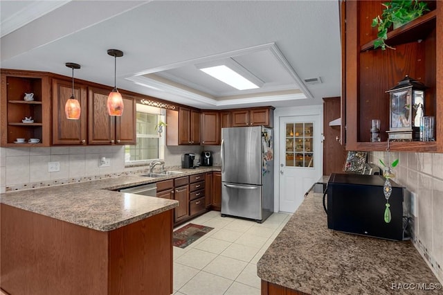 4015 E Parsons Point Rd, Hernando, FL 34442 - kitchen featuring stainless steel appliances, open shelves, a raised ceiling, a peninsula, and decorative backsplash