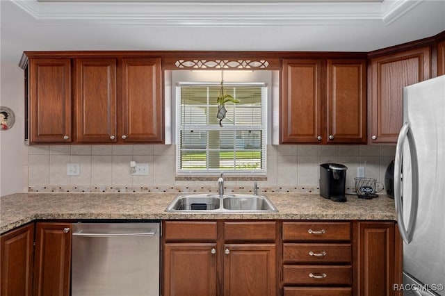 4015 E Parsons Point Rd, Hernando, FL 34442 - kitchen with appliances with stainless steel finishes, tasteful backsplash, crown molding, light countertops, and brown cabinetry
