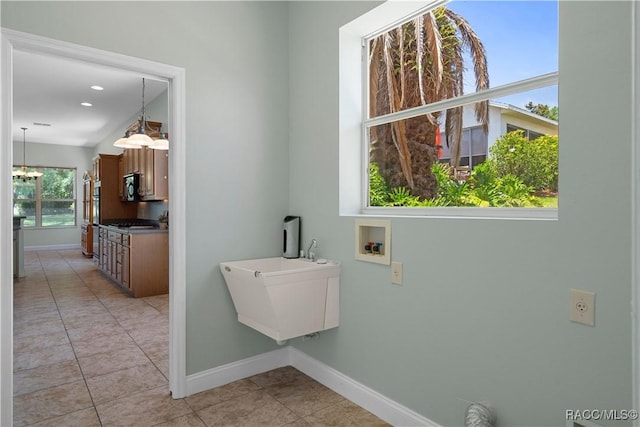 1918 W Crystal Mae Path, Lecanto, FL 34461 - clothes washing area with light tile patterned floors, baseboards, laundry area, and hookup for a washing machine
