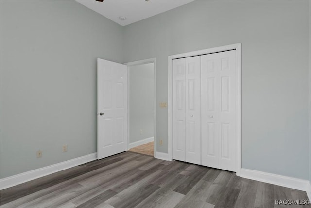 1918 W Crystal Mae Path, Lecanto, FL 34461 - unfurnished bedroom with baseboards, wood finished floors, and a closet