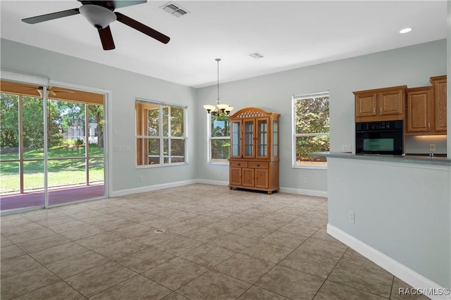 1918 W Crystal Mae Path, Lecanto, FL 34461 - unfurnished dining area featuring light tile patterned flooring, visible vents, a wealth of natural light, and ceiling fan with notable chandelier