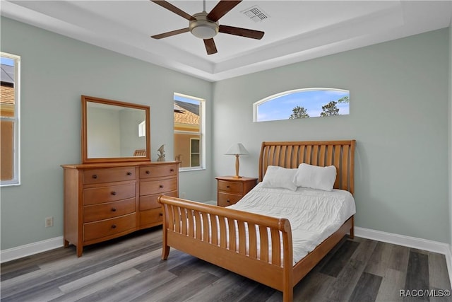 1918 W Crystal Mae Path, Lecanto, FL 34461 - bedroom with a ceiling fan, visible vents, wood finished floors, a raised ceiling, and baseboards