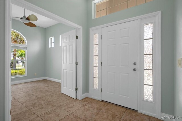 1918 W Crystal Mae Path, Lecanto, FL 34461 - foyer entrance with baseboards, ceiling fan, and light tile patterned floors