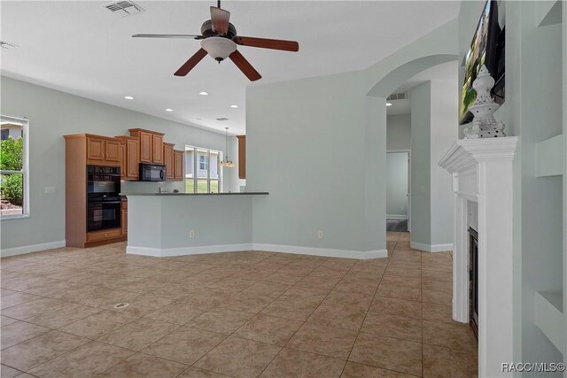 1918 W Crystal Mae Path, Lecanto, FL 34461 - unfurnished living room featuring a ceiling fan, recessed lighting, light tile patterned flooring, and visible vents