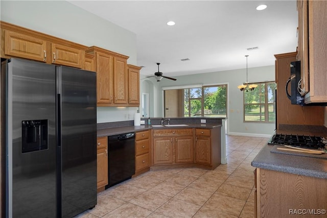 1918 W Crystal Mae Path, Lecanto, FL 34461 - kitchen with a sink, a peninsula, black appliances, and dark countertops