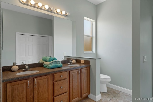 1918 W Crystal Mae Path, Lecanto, FL 34461 - bathroom featuring double vanity, toilet, a sink, and tile patterned flooring