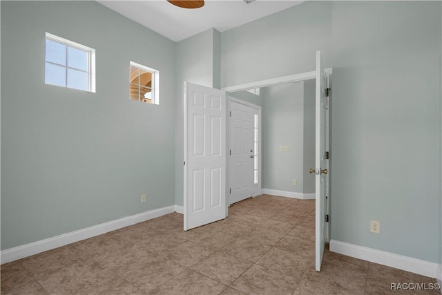 1918 W Crystal Mae Path, Lecanto, FL 34461 - unfurnished bedroom featuring baseboards and light tile patterned flooring