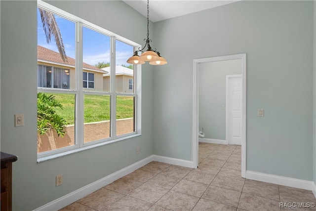 1918 W Crystal Mae Path, Lecanto, FL 34461 - unfurnished dining area with baseboards, light tile patterned flooring, and a healthy amount of sunlight