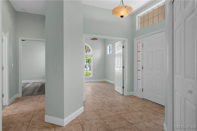 1918 W Crystal Mae Path, Lecanto, FL 34461 - entrance foyer with baseboards, light tile patterned flooring, and a towering ceiling