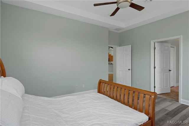 1918 W Crystal Mae Path, Lecanto, FL 34461 - bedroom featuring baseboards, ceiling fan, and wood finished floors