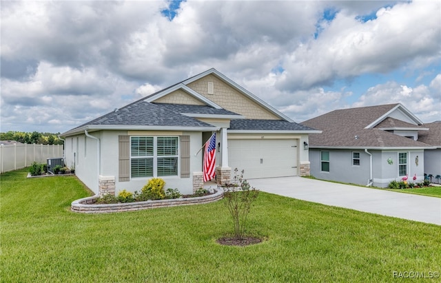 view of front of home with a garage and a front yard