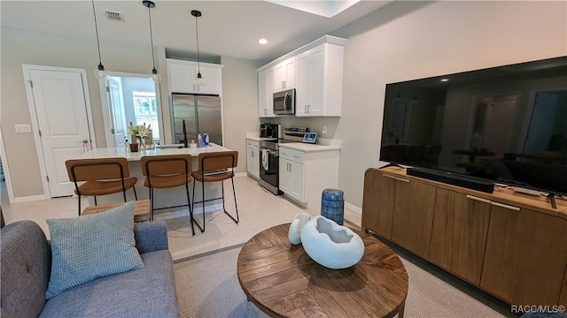 6342 E Grayson St, Inverness, FL 34452 - living room featuring baseboards and recessed lighting