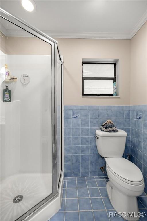 1179 N Point Lonesome Rd, Inverness, FL 34453 - full bath with tile patterned floors, a shower stall, ornamental molding, toilet, and tile walls