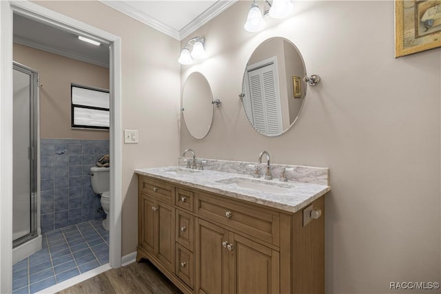 1179 N Point Lonesome Rd, Inverness, FL 34453 - bathroom featuring toilet, double vanity, a shower stall, wood finished floors, and crown molding