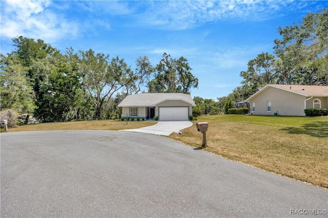 2885 N Attebury Pt, Hernando, FL 34442 - ranch-style home featuring concrete driveway, an attached garage, a front lawn, and stucco siding