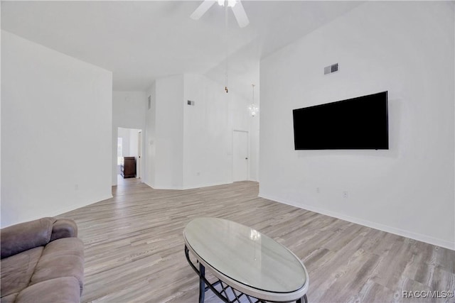 2885 N Attebury Pt, Hernando, FL 34442 - living room with ceiling fan, wood finished floors, and high vaulted ceiling
