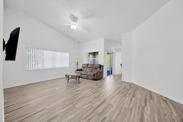 2885 N Attebury Pt, Hernando, FL 34442 - living area with light wood-type flooring, ceiling fan, and high vaulted ceiling