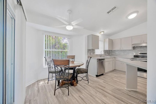 2885 N Attebury Pt, Hernando, FL 34442 - dining area featuring light wood-style flooring, ceiling fan, and vaulted ceiling