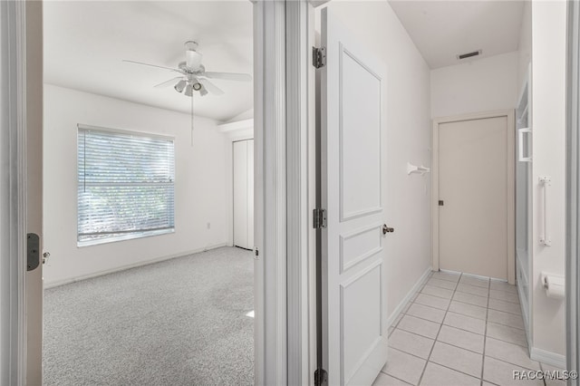 hall with light tile patterned floors