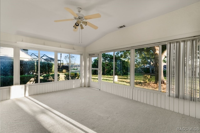 unfurnished sunroom featuring ceiling fan and vaulted ceiling