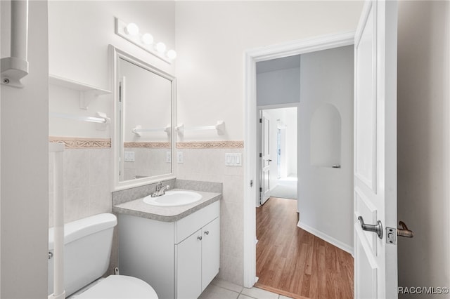 1868 W Shanelle Path, Lecanto, FL 34461 - half bath featuring tile walls, vanity, a wainscoted wall, and tile patterned flooring