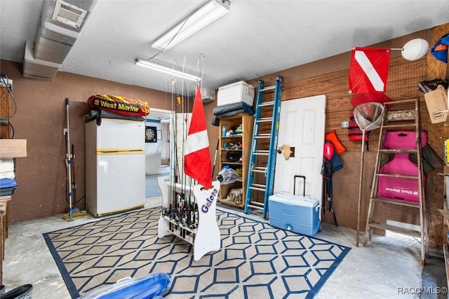 garage with white refrigerator