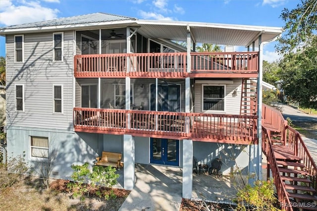 back of property featuring a balcony, a patio, and ceiling fan