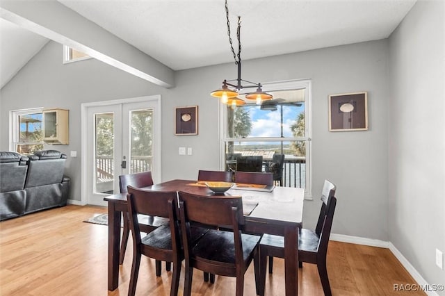 dining room with french doors and light hardwood / wood-style flooring