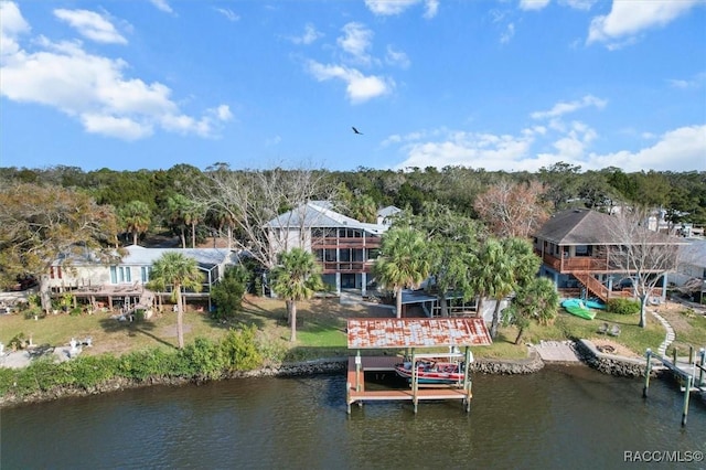 birds eye view of property with a water view