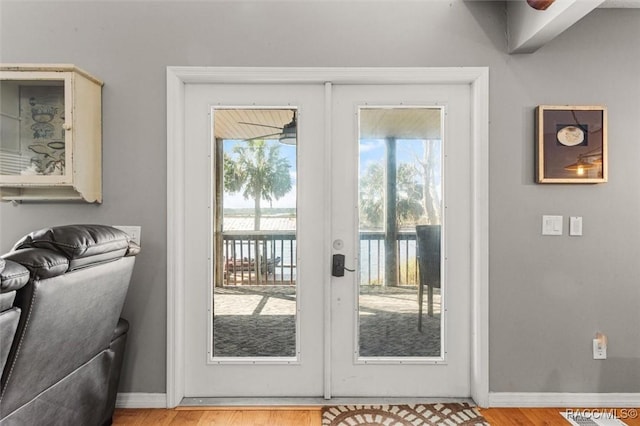 doorway to outside with hardwood / wood-style flooring, plenty of natural light, and french doors