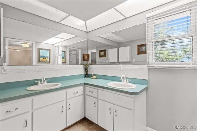 bathroom with vanity and backsplash