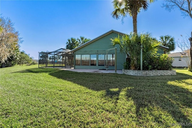 view of yard featuring a patio area and a lanai