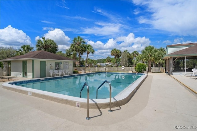 view of swimming pool with a patio area