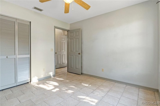 unfurnished bedroom featuring a closet and ceiling fan